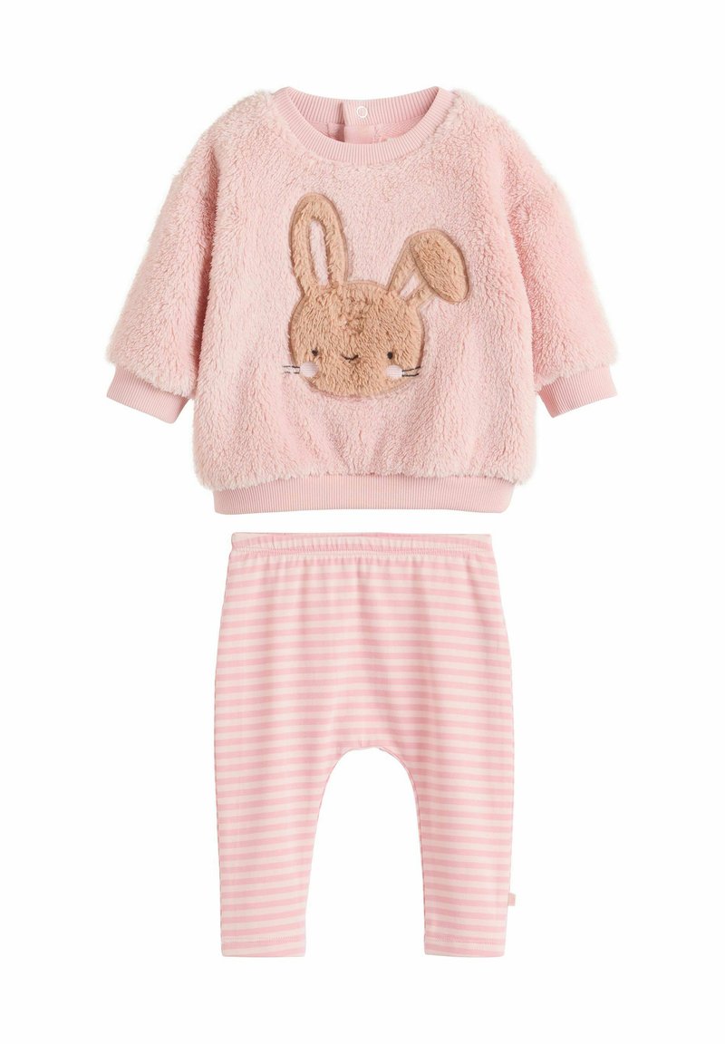 Rosa Kleinkinder-Outfit mit einem flauschigen Sweatshirt mit einem Hasengesicht-Applikation und gestreiften Hosen. Weicher Stoff, runder Ausschnitt und elastischer Bund.