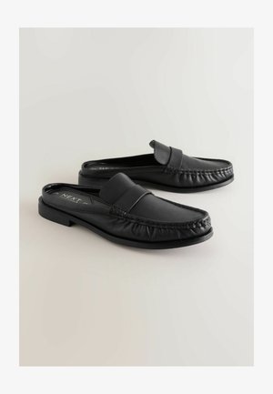 Schwarze Ledermokassins mit rundem Zehenbereich, einer gesteppten Kante und einer glatten Oberfläche. Schlupfdesign ohne sichtbare Beschläge.