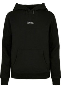 Black hoodie made of cotton with a front pocket, featuring the word "loved." in white text on the chest and drawstring detail at the hood.