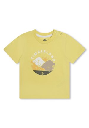 Geel T-shirt met korte mouwen van katoen, voorzien van een ronde grafische print met de tekst "Timberland" en een illustratie van een zonsonderganglandschap.
