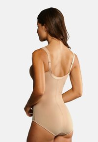 Beige bodysuit with wide straps, smooth texture, and a fitted design. Includes adjustable straps and low-cut back for comfort.