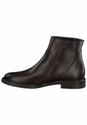 Bottes chelsea en cuir marron avec une finition lisse, des fermetures éclair sur le côté, un bout arrondi et un petit talon empilé. Design épuré avec un minimum de détails.