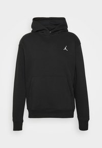 Schwarzer Baumwoll-Hoodie mit einer Kängurutasche, gerippten Bündchen und einem weißen Jumpman-Logo auf der Brust. Weicher Stoff und lockere Passform.