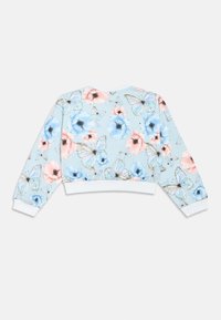 Floral cropped sweatshirt in light blue, featuring pastel flowers and butterflies. Ribbed cuffs and hem in white, soft fabric texture.