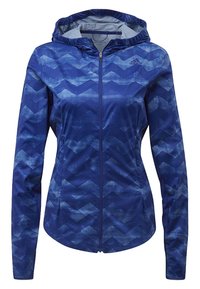 Veste zippée bleue avec capuche, présentant un motif ondulé et un tissu texturé. Le design intègre différentes nuances de bleu.