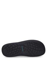 Black rubber shoe insole with a textured surface, featuring a diamond pattern for traction and a blue logo label. Size 42 indicated.