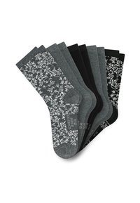 Zeven paar middelhoge sokken in grijs en zwart, waarvan sommige witte bloemmotieven hebben en andere effen kleuren zijn, mooi uitgewaaierd gepresenteerd.