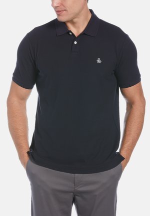 Navy blue polo shirt made of cotton blend. Features a two-button placket, short sleeves, and a small logo on the chest. Smooth texture.
