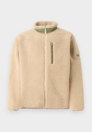 Beige Fleecejacke mit hohem Kragen, durchgehendem Reißverschluss und grüner, mit Reißverschluss versehenem Brusttasche. Weiche Textur mit einer leicht oversized Passform.