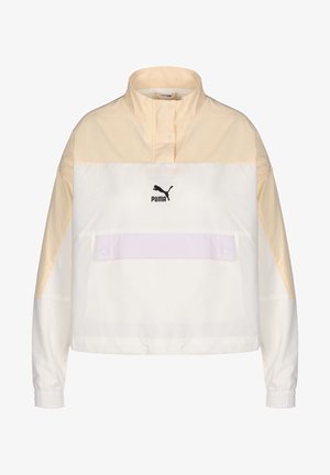 Puma letvæg pullover jakke i creme og lys beige, med høj krave, elastiske manchetter og en frontlomme med knaplukning.