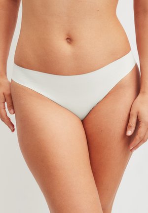 Hellgrüner nahtloser Bikini-Slip mit glatter Textur, niedrigem Schnitt und minimaler Abdeckung. Basic-Stil ohne Muster oder Akzente.