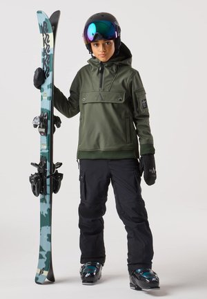 Green hooded jacket with front pocket, black ski pants, black gloves, and a blue-green ski with bindings. Black helmet and mirrored goggles.