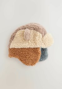 Shearling hat with a soft texture, featuring a mix of beige, brown, and blue colors. Rounded shape with a band across the top.