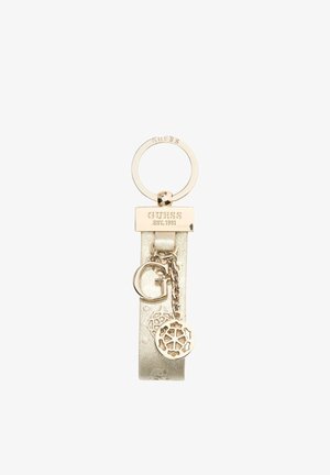 Portachiavi Guess in tono oro con cinturino in pelle goffrata, piastra con logo incisa e ciondoli pendenti, tra cui una "G" e un disegno a fiocco di neve.