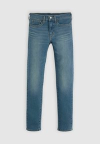 Jean slim bleu avec bouton et fermeture éclair à l’avant, cinq poches et légère décoloration aux cuisses et aux genoux.