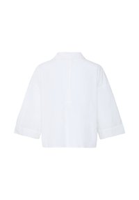 Veste blanche courte avec larges manches 3/4, col à revers et détail de couture au dos, vue de dos sur un fond uni.