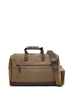 Bruine canvas reistas met leren handvatten, voorvak met ritssluiting en verstelbare schouderriem met gewatteerd gedeelte.