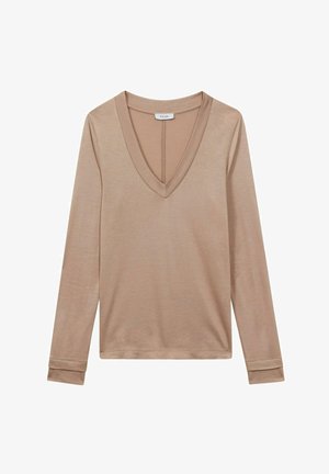 Lange mouwen top in lichtbeige, met een diepe V-hals ontwerp. Gemaakt van zachte materialen met aansluitende manchetten en een schoon, minimalistisch stijl.