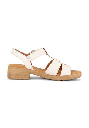 White leather open-toe sandal with adjustable strap, cushioned insole, and low wooden block heel against white background.
