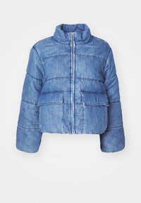 Cropped blue denim puffer jacket with a high collar, front zipper, and two front patch pockets. Features horizontal quilted stitching.