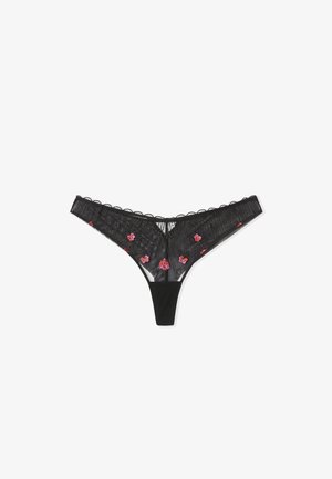 Zwarte kanten string met bloemige borduursels in het roze. Heeft doorschijnende panelen, gegolfde randen en een gladde stof tailleband.