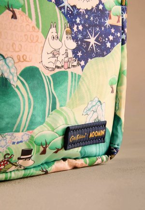 Multicolored fabric bag featuring Moomin characters among green hills, blue night sky with stars, and a navy label with "Cath Kidston Moomin."