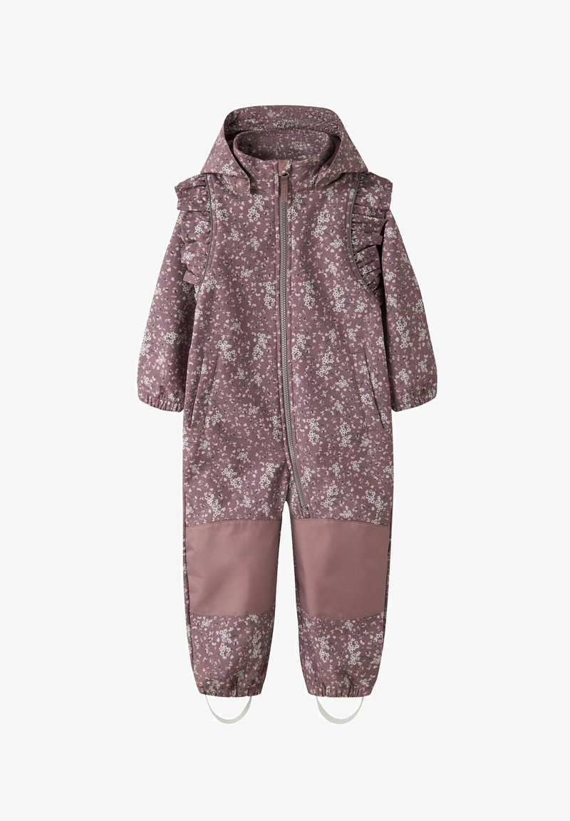 Salopette imperméable à motif floral violet avec des accents en volants, fermeture éclair avant sur toute la longueur, poignets élastiques et renforts aux genoux en couleur unie.