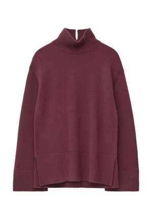 Burgundy knit turtleneck sweater with ribbed cuffs and hem, featuring a high collar and an asymmetrical bottom edge for added texture.