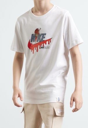 Person wearing a white T-shirt with a red dripping Nike swoosh, an ice cream cone on the "I," and "TREAT Your Sole" text.