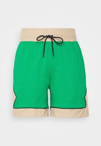 Zelené bavlněné šortky s ribbovaným béžovým pasem. Obsahují černou šňůrku na stažení a postranní panely s kontrastním černým obrysem.