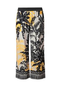 Kalhoty s širokými nohavicemi vyrobené z lehké tkaniny, s tropickým vzorem v černé, žluté a bílé barvě, elastickým černým pasem a geometrickým lemem.