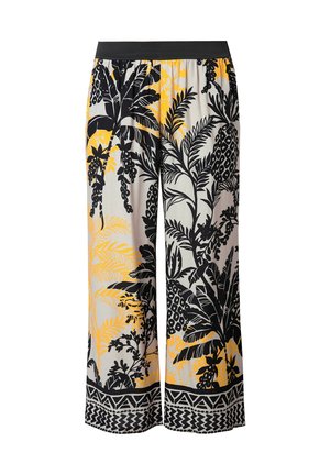 Vyöruiskat, jotka on valmistettu kevyestä kankaasta ja joissa on musta, keltainen ja valkoinen trooppinen kuvio, joustava musta vyötärö ja geometrijakäyrä.