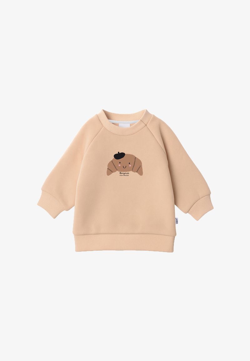 Beiges Sweatshirt für Kleinkinder mit gerippten Bündchen und Saum, vorne mit einem lächelnden Croissant mit schwarzem Barett und dem Wort „Bonjour“.