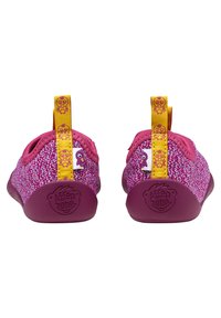 Children's shoes with a textured pink upper, yellow pull tab, and playful logo on the heel. Designed for comfort and flexibility.