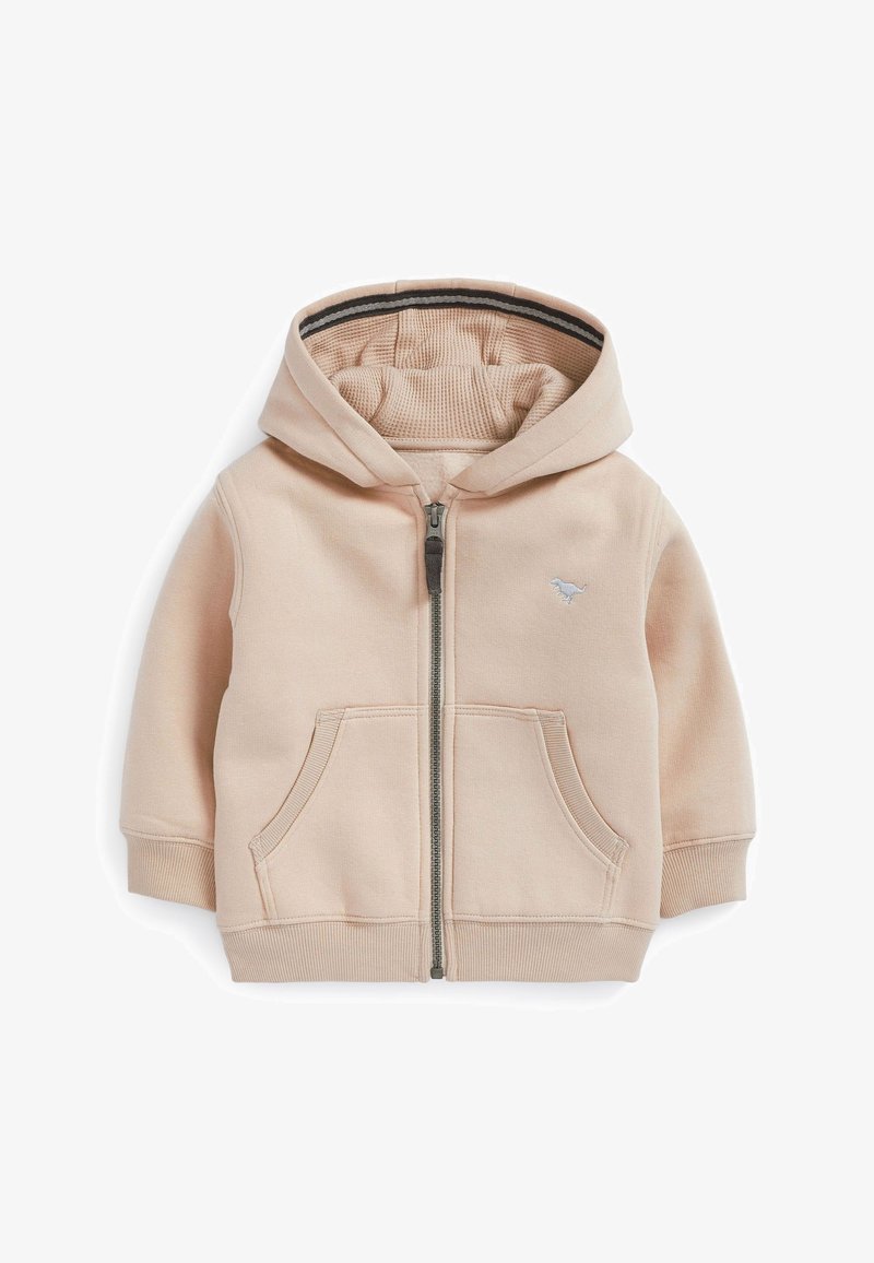 Sweat à capuche beige pour tout-petit avec fermeture éclair sur le devant, deux poches kangourou, poignets et ourlet côtelés, capuche doublée en tissu texturé, et petit logo de dinosaure.