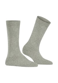 Graue Stricksocken mit weicher Textur, mittlerer Länge und gerippten Bündchen. Der Stoff zeigt ein dezentes Melanmuster für visuelles Interesse.