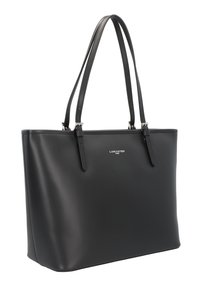 Black tote bag in matte faux leather, rectangular shape with dual top handles, silver hardware, and a subtle logo on the front.