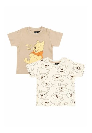 Two toddler t-shirts: beige with Winnie the Pooh and text, white with repeated smiling Winnie the Pooh faces.