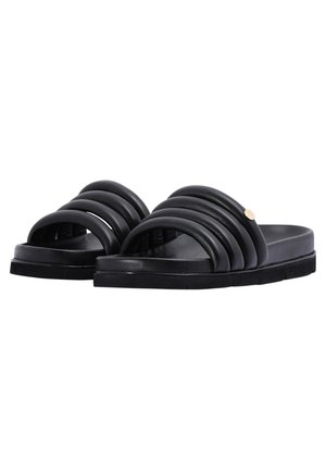 Black slide sandals with three thick, curved straps and a smooth matte finish. Features a flat sole and a small gold accent detail.