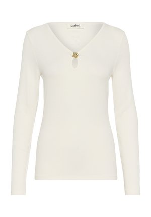 Langärmliges, cremefarbenes Oberteil mit V-Ausschnitt und dekorativem goldenen Knopfdetail an der Brust. Weicher, strukturierter Stoff.