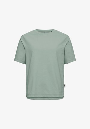 T-shirt en coton vert clair uni à manches courtes, col rond, avec une petite étiquette de marque noire sur la couture latérale inférieure.
