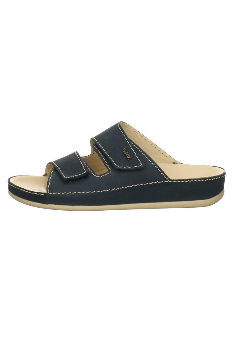 Sandale à glissière bleu foncé avec deux sangles réglables en Velcro, une semelle intérieure rembourrée beige et des coutures blanches contrastantes le long des bords.