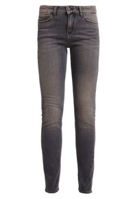 Jeans ajustados en denim gris oscuro, con un leve desvanecimiento, cinco bolsillos, cierre de botón y trabillas para el cinturón. Textura suave, con costuras mínimas.