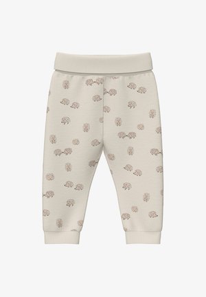 Pantalons de survêtement en coton beige avec un motif de hérisson répétitif, taille élastique et poignets. Texture douce avec une coupe décontractée.