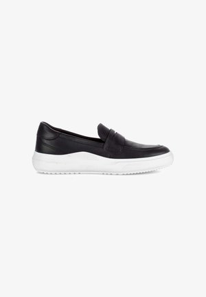 Black leather slip-on loafer with white rubber sole, featuring a stitched strap detail across the top, shown in side profile.