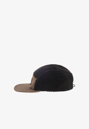 Black fleece cap with a brown glossy visor, rounded shape, textured fabric, and a loop detail at the back. Notable seam stitching visible.
