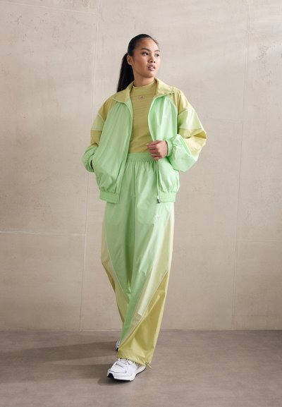 adidas by Stella McCartney TRACKTOP - Training jacket - glow green/halo gold