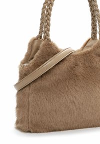 Tan faux fur handbag with braided leather handles and a smooth leather shoulder strap.