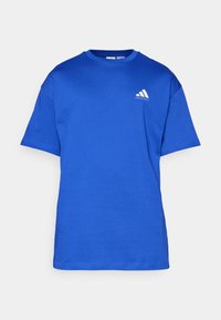 Short-sleeve blue cotton t-shirt with a crew neck and a white accent logo on the left chest area. Smooth texture, regular fit.