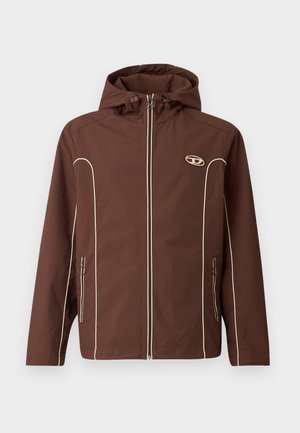 Pruun jakk kapuutsi ja valge äärisega, millel on lukuga eest sulgemine ja küljetaskud lukupeatustega. Tekstuuriga kangas ja logo rinnal.